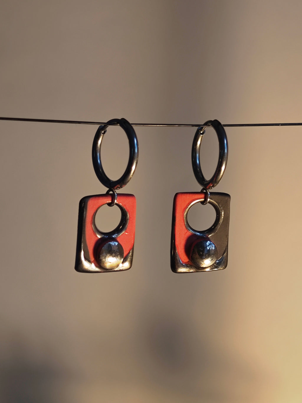 press the button earrings